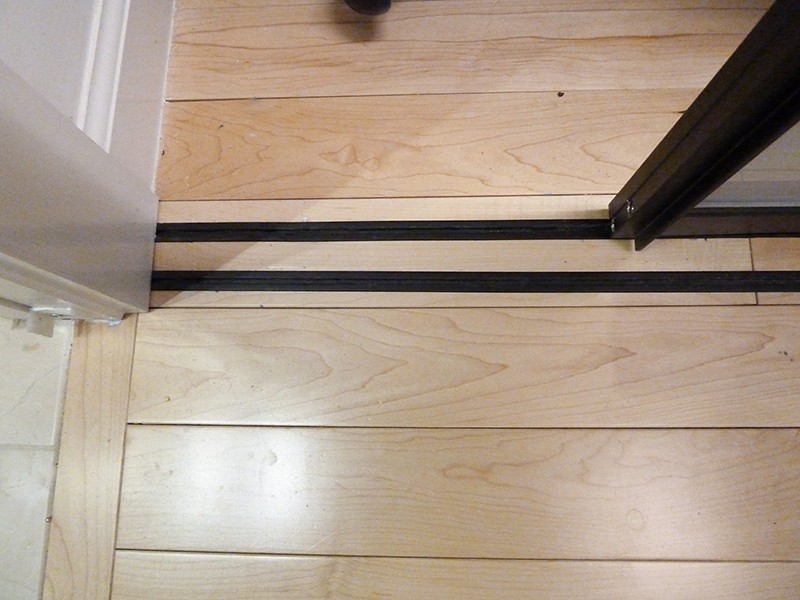floating floor door track